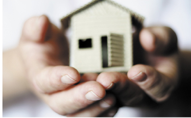 Image of a house in hands
